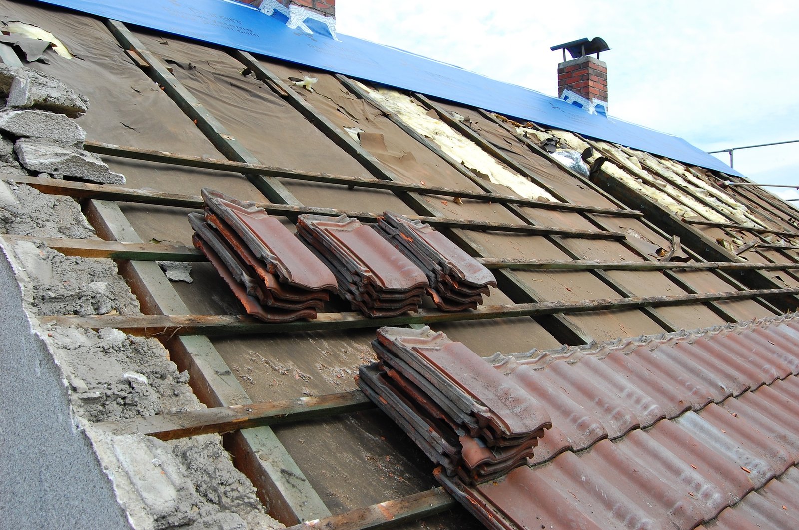 tiles being removed from a roof